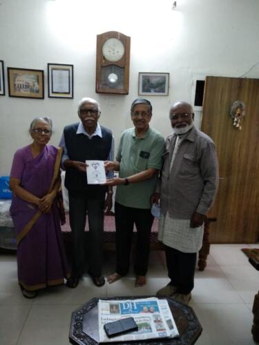 Ingathering Book being presented to Mr Abraham